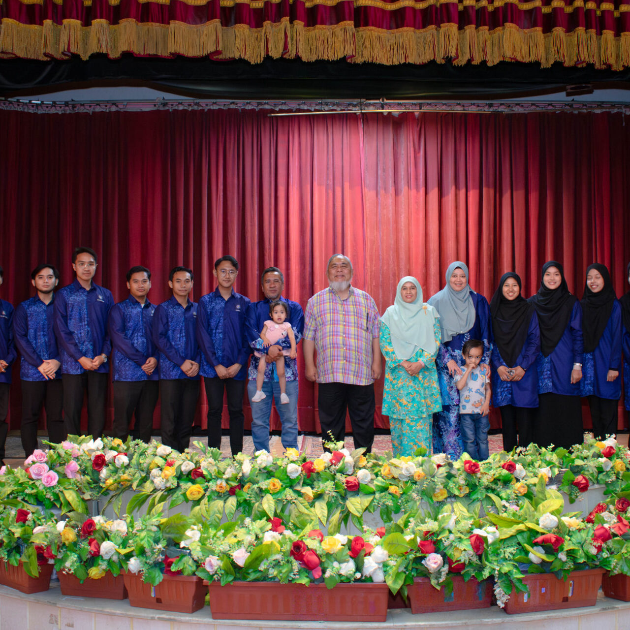 Organisers and participants taking a group photo on the stage in Egypt