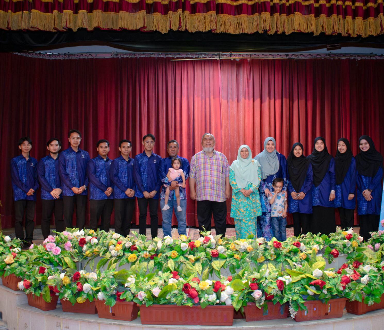 Organisers and participants taking a group photo on the stage in Egypt