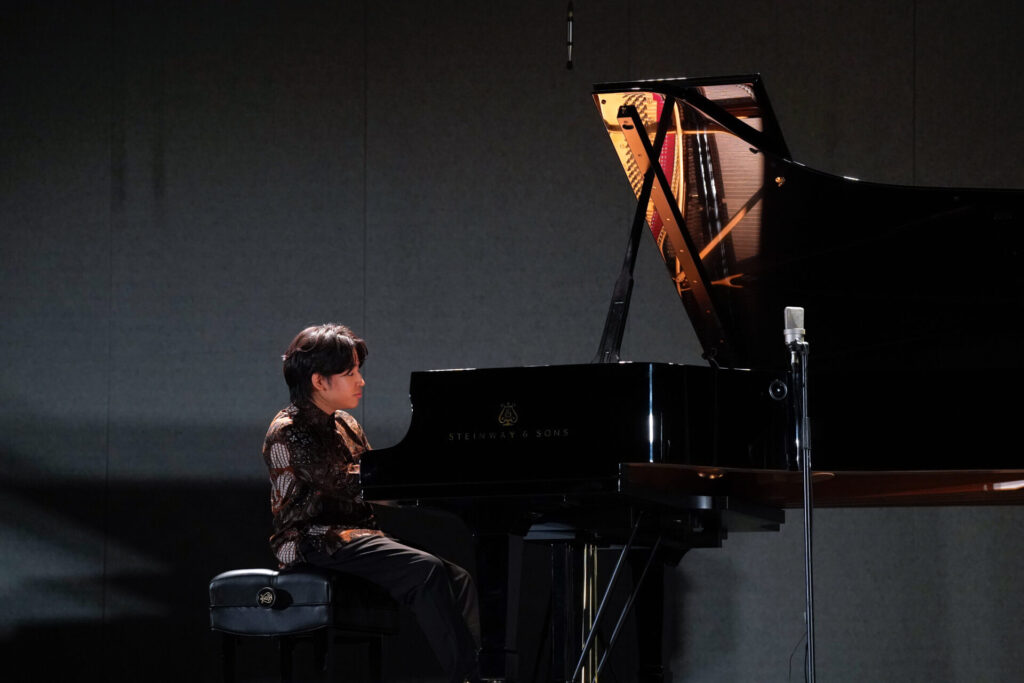 Vincent Ong playing the piano
