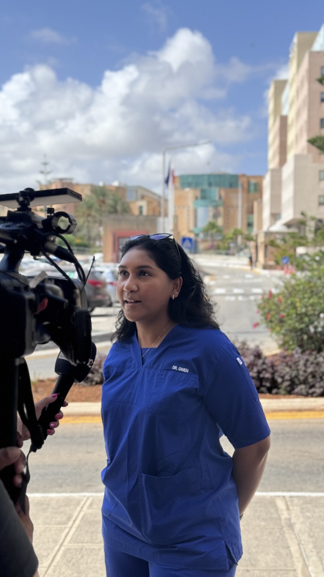 Gwen being interviewed by a news outlet on site