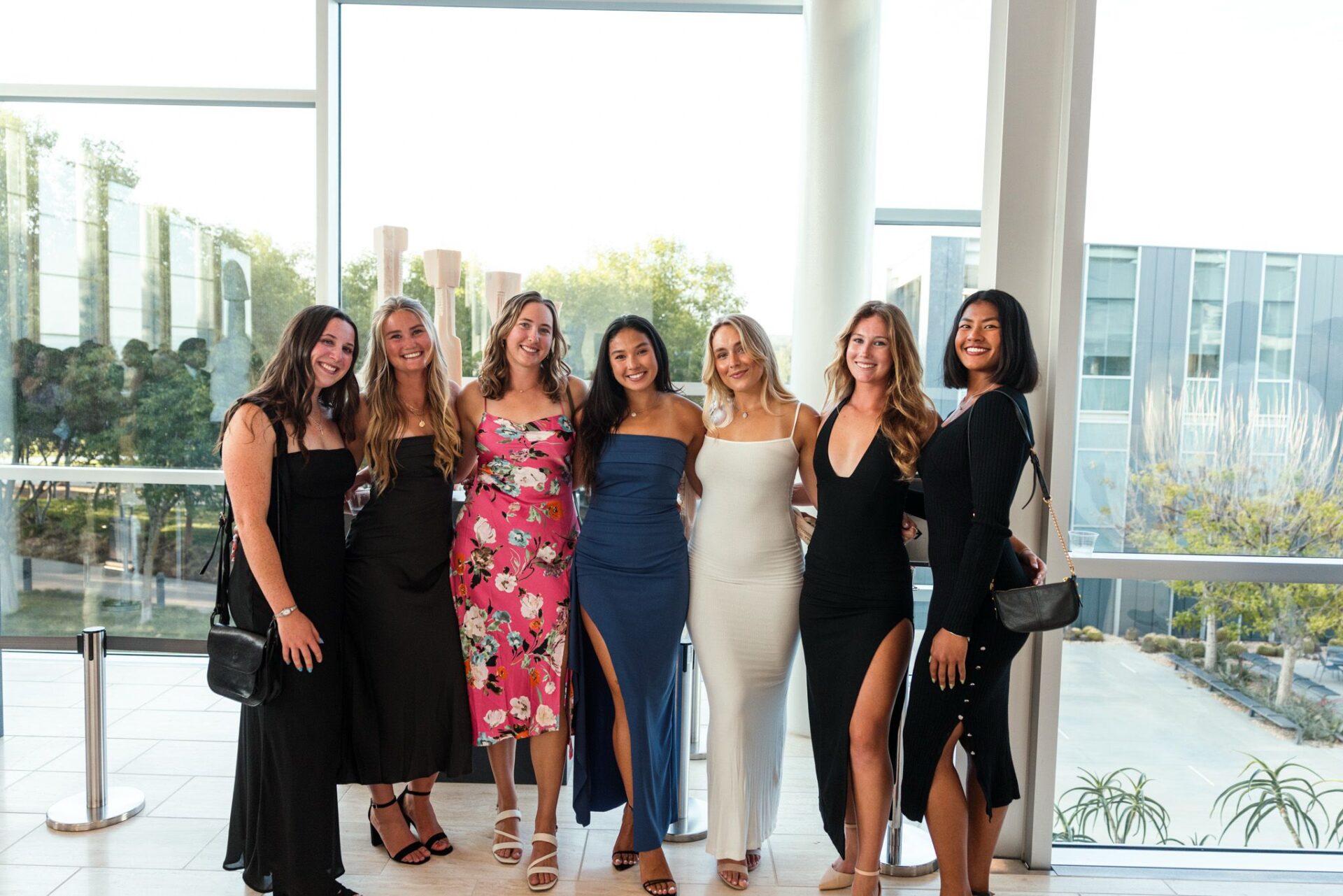 Tasha Mae with friends in the USA at a formal dinner