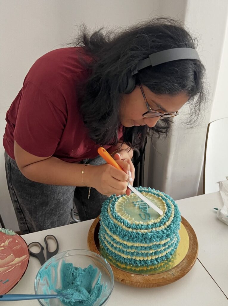 Gwen decorating a home baked cake