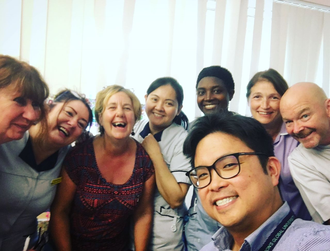 Dr. David with his colleagues during his time working in the United Kingdom (UK). 
